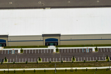 Aerial view of industrial park with goods warehouses and logistics centers in city zone from above
