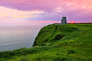 Fototapeta na wymiar Sunset at the Cliffs of Moher with O'Brien's Tower, Ireland
