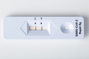 Positive test for Covid virus.Portable Covid test for home use. © Александр Поташев