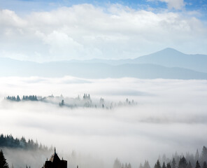 Morning fog on the slopes of the Carpathian Mountains (Yablunytsia village, Ivano-Frankivsk oblast, Ukraine).