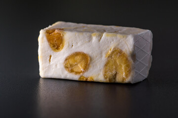 piece of nougat on black background
