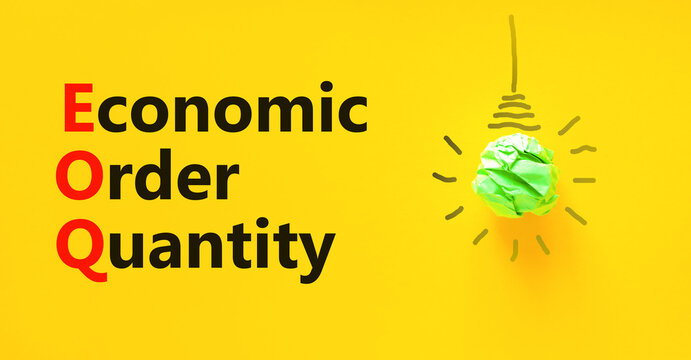 EOQ economic order quantity symbol. Concept words EOQ economic order quantity on paper on beautiful yellow background. Green light bulb icon. Business EOQ economic order quantity concept. Copy space.