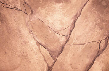 Brown background from decorative plaster with abstract spots. Unusual beige wall texture with beautiful patterns, creative surface background. Front covering for facing of buildings.