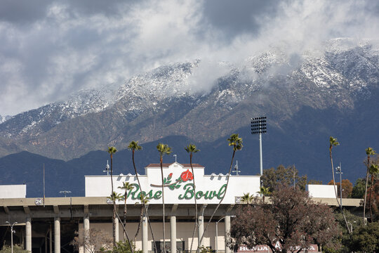Pasadena, CA - February 2 2023:  Snow covered mountains behind the Rose Bowl Stadium