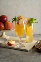 Refreshing apple cocktail drinks with fresh red apples
