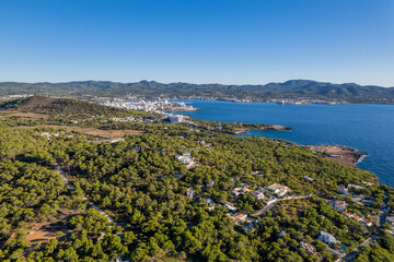 Fototapeta na wymiar Aerial photographs of the beaches of Cala Salada y Cala Saladeta ,on the island of Ibiza during a sunny summer day with blue sky and turquoise water