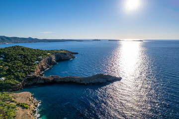 Fototapeta na wymiar Aerial photographs of the beaches of Cala Salada y Cala Saladeta ,on the island of Ibiza during a sunny summer day with blue sky and turquoise water