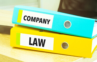 company law on colourful folders on table