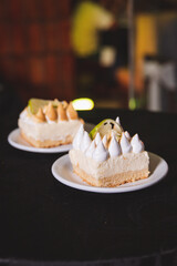 Lemon pies served on different plates.