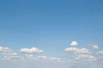beautiful and expansive view of a bright blue sky adorned with fluffy white clouds.