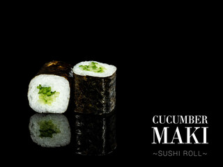 Close up to Maki sushi roll pieces with mirror reflection on black background. Sushi roll with cucumber and nori seaweed on top. Ready menu advertising banner with text and copy space.