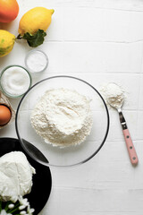 Lemon, orange and ricotta bund cake on a white background