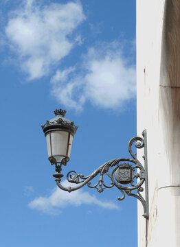 Vintage authentic street lantern downtown in Lavapies district, Madrid, Spain. Vertical photo