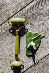 Gouache roll and scraper. High quality photo. wooden background