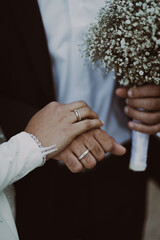 bride and groom holding hands