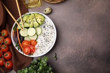 Delicious poke bowl and ingredients on textured table, flat lay. Space for text
