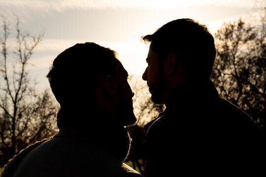 Gay couple in love looking into each other's eyes