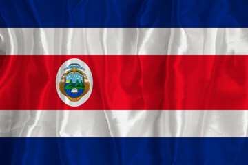 The flag of Costa Rica on a silk background is a great national symbol. Fabric texture The official state symbol of the country.