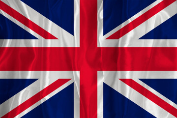 The British flag on a silk background is a great national symbol. Fabric texture The official state symbol of the country