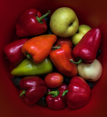 Ripe farm yellow, red sweet pepper and apple and tomato.