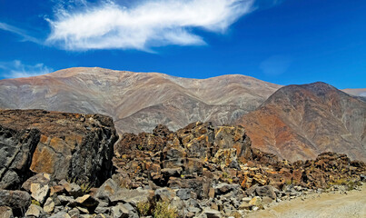 Adventure travel in remote life hostile landscape: Sandy pacific coastal dirt track road, sharp...