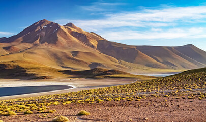 Beautiful dry arid wild landscape,  two lakes in andes mountains high plains - Laguna Miniques and...