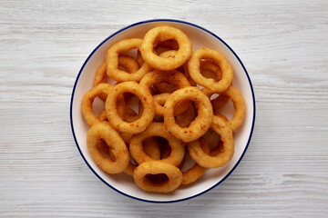Homemade Breaded Onion Rings on a Plate, top view. Flat lay, overhead, from above.