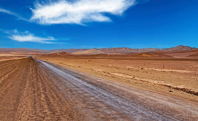 Endless eternally long empty straight desert road, red monotonous vegetationless life hostile flat...