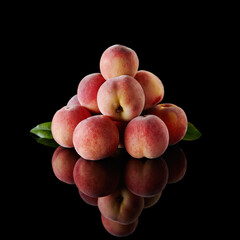 Fresh peaches on dark background