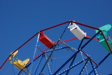 ferris wheel up high in the blue sky