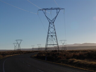 Power pylons in desertic environment. Desert Road, Tongariro National Park, Central Plateau.