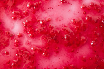 Raspberry jam background. Berry confiture close up. The concept of sweet home canning