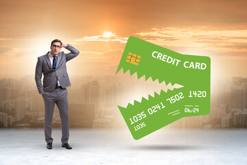 Businessman in credit card debt concept