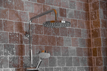 rain shower in the bathroom. Silver shower in the bathroom with beige tiles. Beautiful shower. Water treatments. A watering can for the shower.