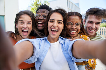 Selfie young excited friends looking at camera happy. Smiling Group of people having fun together...