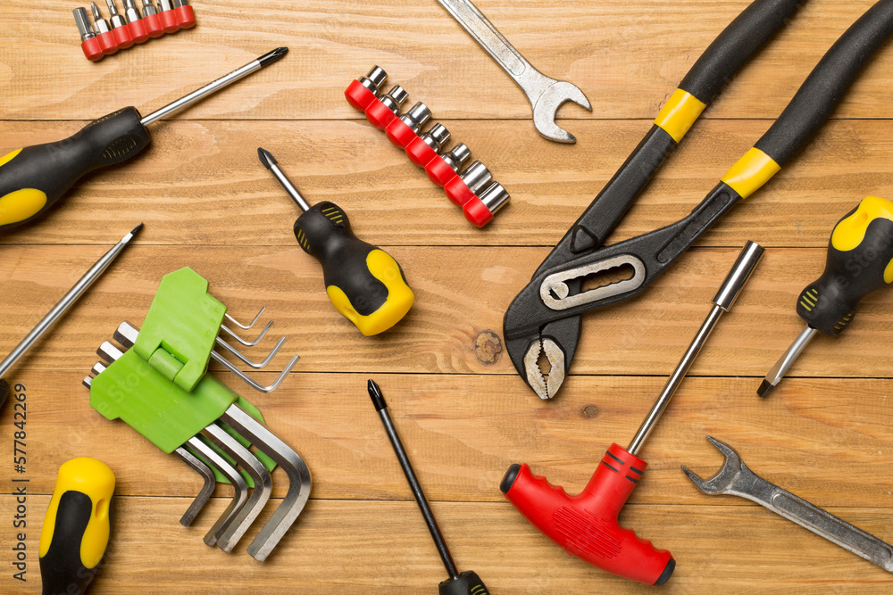 Wall mural Set of tools on wooden background, top view