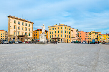 Fototapeta na wymiar The spacious Piazza della Repubblica town square in the Tuscan coastal port town of Livorno, Italy, with the monument statue of Grand Duke Ferdinand III in view.