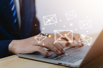 Businessman sending a letter from a laptop. electronic mail concept is online communication on the...