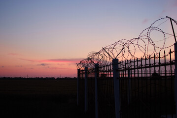 restricted area barbed wire bars prison