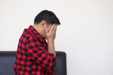 Closeup Asian man feels sad, stressed, depressed, hands covered his face. crying. Concept,...