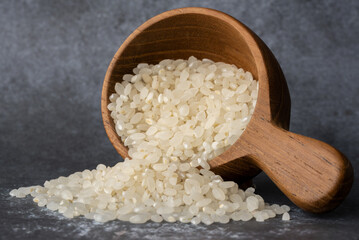 Uncooked Sushi Rice Spilled from a Scoop
