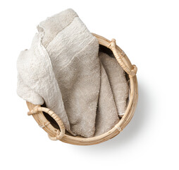 rough natural linen towel in a hand-made basket isolated over a transparent background, spa /...