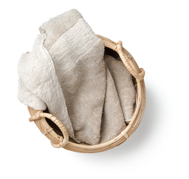 rough natural linen towel in a hand-made basket isolated over a transparent background, spa / wellbeing / natural beauty and cosmetics / lifestyle concept design element, top view / flat lay