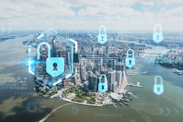 Aerial panoramic helicopter city view on Lower Manhattan district and financial Downtown, New York, USA. The concept of cyber security to protect confidential information, padlock hologram