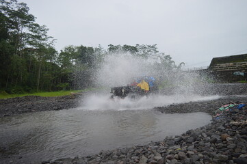 Yogyakarta, Indonesia - 12 Decembre 2021 : Offroad car rides, jeep cars, Merapi Yogjakarta Indonesia lava tour, one of the famous rides in Indonesia