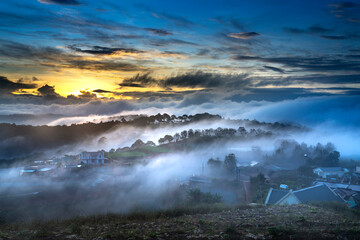Beautiful images of the radiant dawn with reflecting rays through the fanciful clouds on over the pine forests, which created an impressive breathtaking scene of highlands in the morning in Dalat, VN