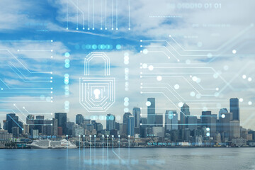 Fototapeta na wymiar Seattle skyline with waterfront view. Skyscrapers of financial downtown at day time, Washington, USA. The concept of cyber security to protect confidential information, padlock hologram