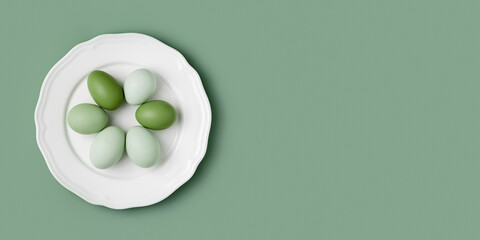 Top view of green chicken eggs on white plate. Minimal style banner with colored eggs on pastel background. Fresh useful eggs with colored eggshells, monochrome easter holiday background