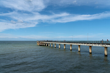 Fototapeta premium View of the Baltic Sea and the pier from the promenade of the seaside resort Zelenogradsk, Kaliningrad region, Russia