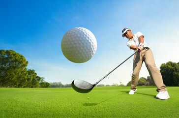 Motion action of golfer teeing off with drivers. - obrazy, fototapety, plakaty